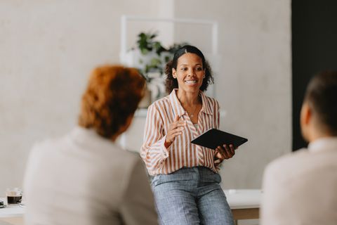 Facilitator leading a small group meeting